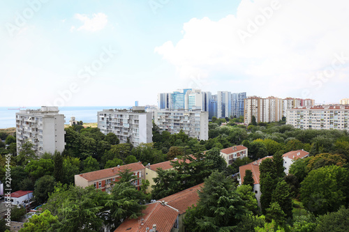 Picturesque view of city with beautiful buildings near sea