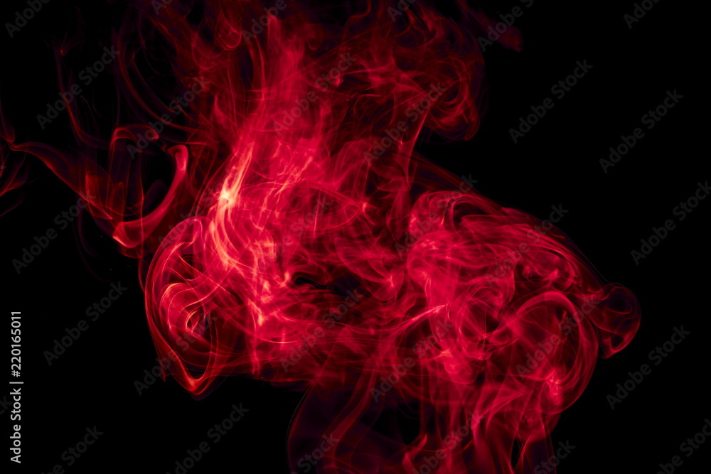 Obraz premium Red smoke on black background