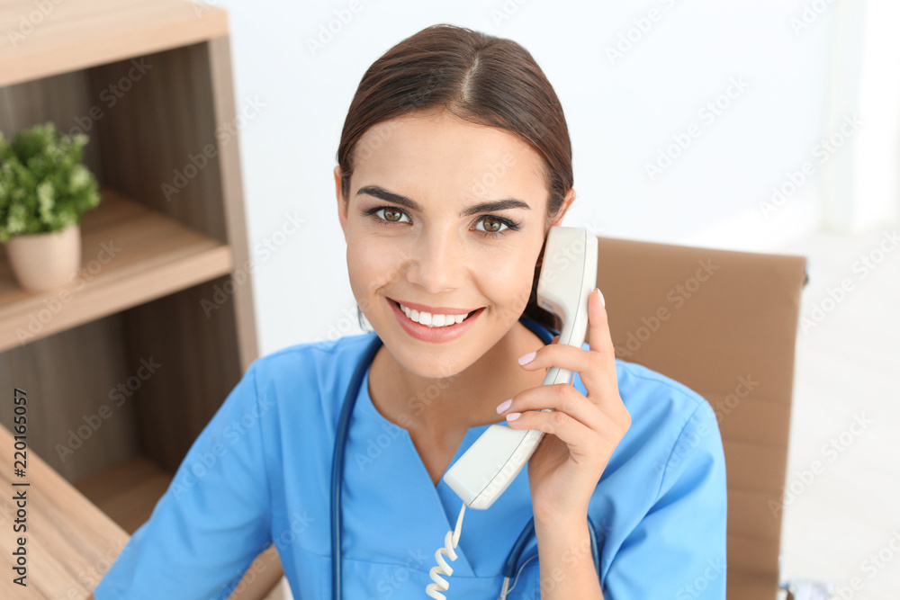 Female medical assistant at workplace in clinic. Health care service Female medical assistant at workplace in clinic. Health care service