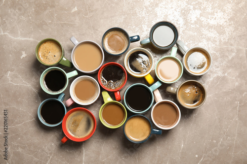 Flat lay composition with cups of coffee on gray background. Food photography