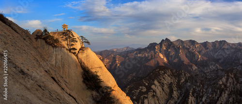 Huashan Sunset, Mount Hua - Huayin, near Xi'an in Shaanxi Province China. Chess Playing Pavilion, Pagoda at the top of a Cliff, Steep Vertical Drop-off, Famous yellow granite mountains of China. 华山 photo