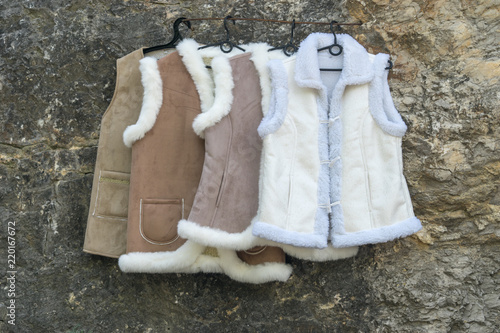Foto street sale of suede vests on fur.