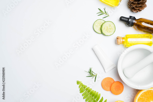 scrubs with natural ingredients rosemary orange cucumber and leaves on white