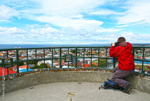 Unrecognizable Tourist taking photo of Scenic view of Punta Arenas, Chile. Magellan Strait. Patagonia, South America