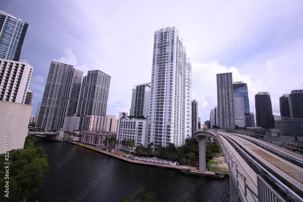 Cityscape of Miami Skyline with Tall Buildings and Train Bridge Over the River in Brickell