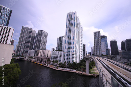 Cityscape of Miami Skyline with Tall Buildings and Train Bridge Over the River in Brickell © Mitchell