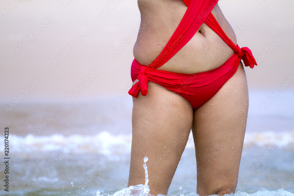 Woman show sex symbol with red bikini Stock Photo | Adobe Stock