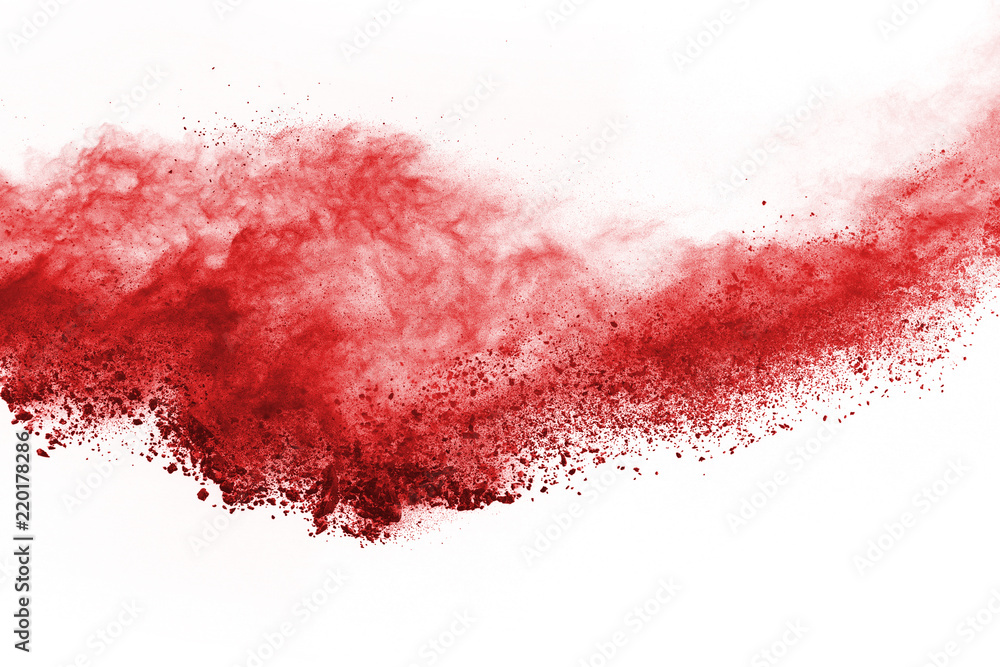 Freeze motion of red powder exploding, isolated on white background. Abstract design of red dust cloud. Particles explosion screen saver, wallpaper