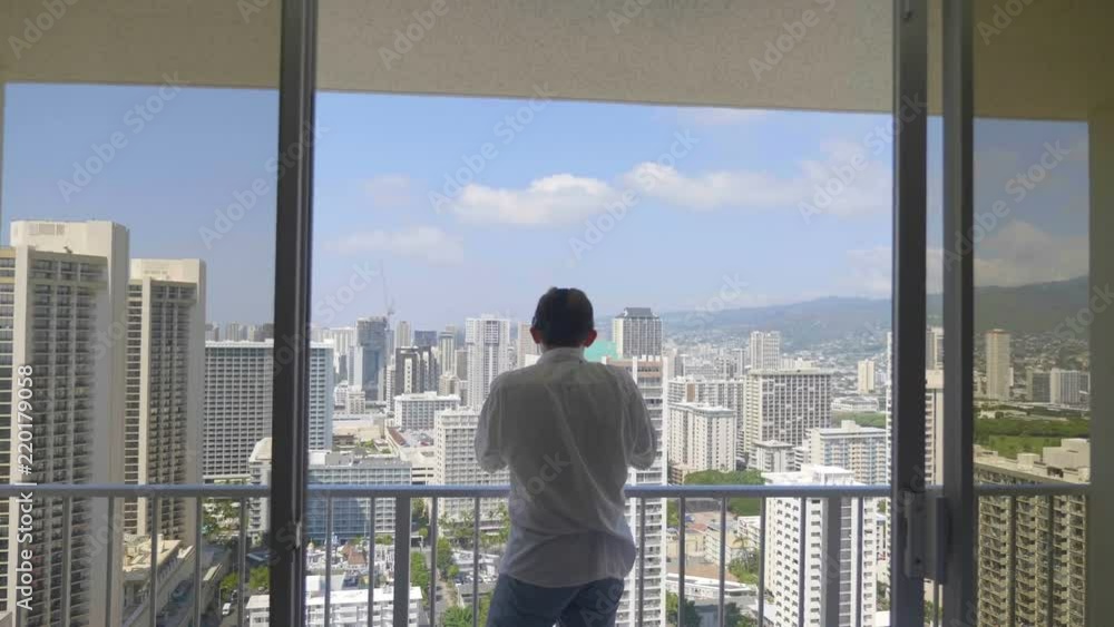 Man playing game in virtual reality glasses in Honolulu in 4k slow motion 60fps Man playing game in virtual reality glasses in Honolulu in 4k slow motion 60fps