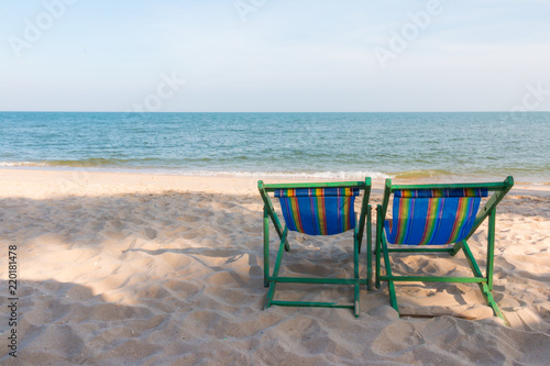 empty wooden beach chair at the beach © pandaclub23