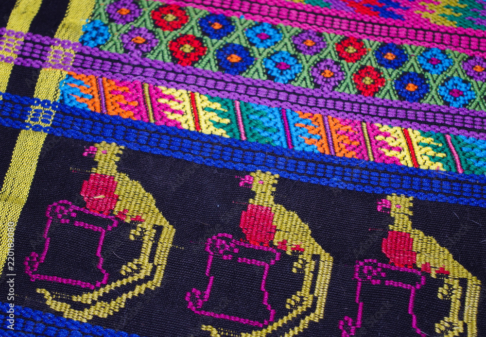 Guatemalan tapestry with stylized quetzal birds Guatemalan tapestry with stylized quetzal birds