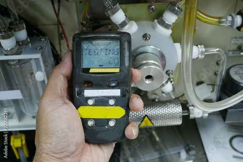 Personal H2S Gas Detector,Check gas leak. Safety concept of safety and security system on offshore oil and gas processing platform, hand hold gas detector. 