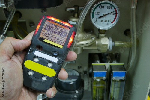 Personal H2S Gas Detector,Check gas leak. Safety concept of safety and security system on offshore oil and gas processing platform, hand hold gas detector for check hydrocarbon leak.