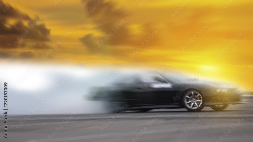 Fototapeta premium Side view car drifting on track with grain, Sport car wheel drifting and smoking on track.