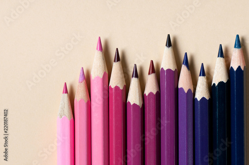 Color pencils isolated on cream background.
