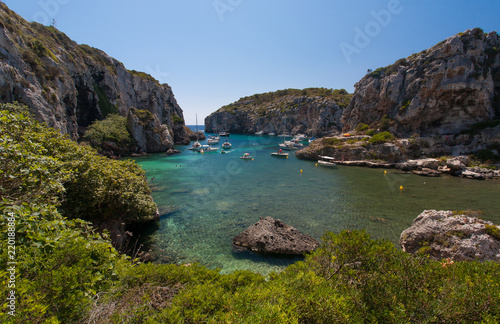 Beautiful sea cove with turquoise water and rocky cliffs - Minorca Baleari Islands Spain 