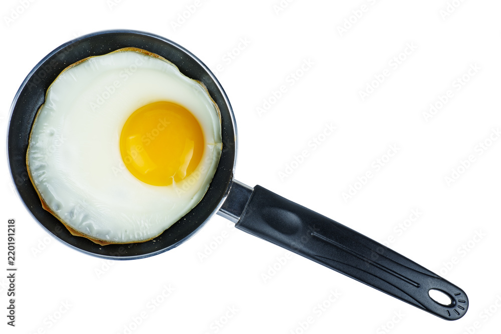 Fried egg in a tiny pan isolated on white background Fried egg in a tiny pan isolated on white background
