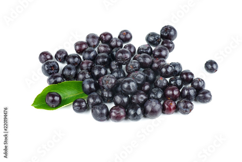 Pile of chokeberries isolated on white background
