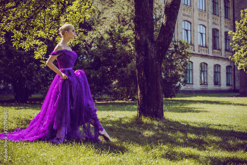 Young Ballerina in vintage look. Ballet Dancer Girl. Image of a Dancing Woman. Lady in purple evening dress demonstrated femininity. Classical Choreography Style  © T.Den_Team