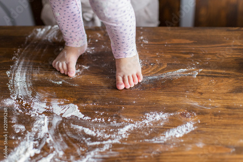 Top vien on little foots in flour on kitchen table photo