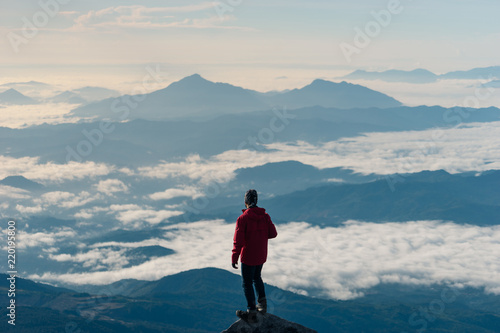 A man enjoy a view on top of Kinabalu mountain peak, Sabah, Malaysia © skazzjy