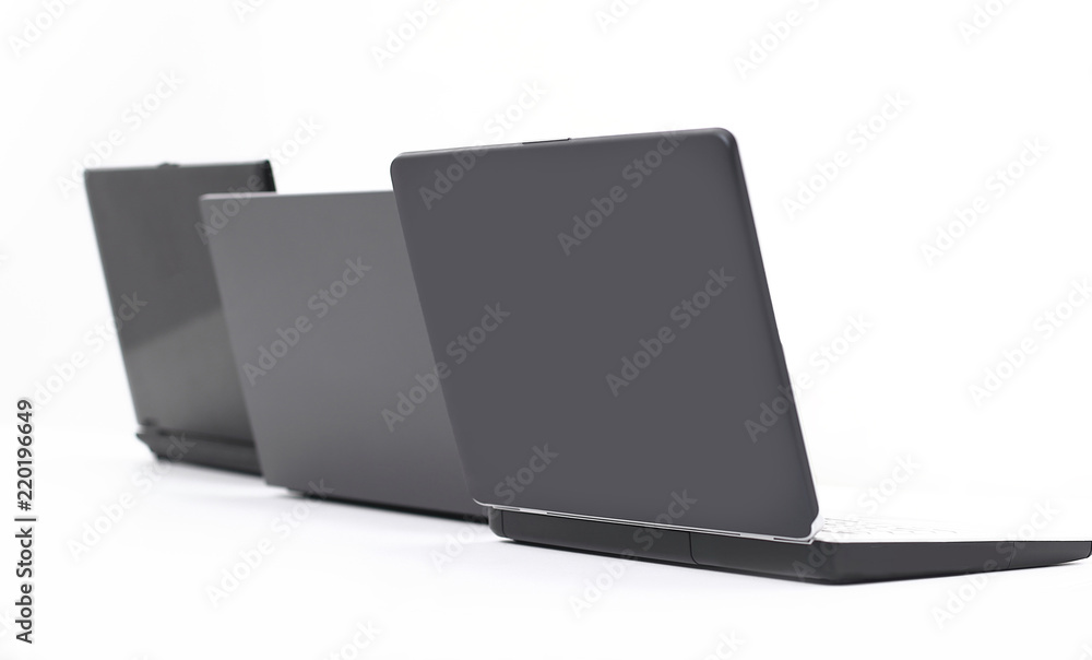 three open laptop in the workplace .isolated on white three open laptop in the workplace .isolated on white