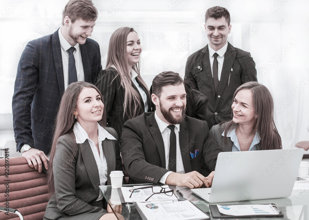 concept of teamwork - a successful business team in the workplace in the office concept of teamwork - a successful business team in the workplace in the office
