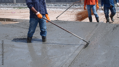 Skilled workers are working to concrete roads.