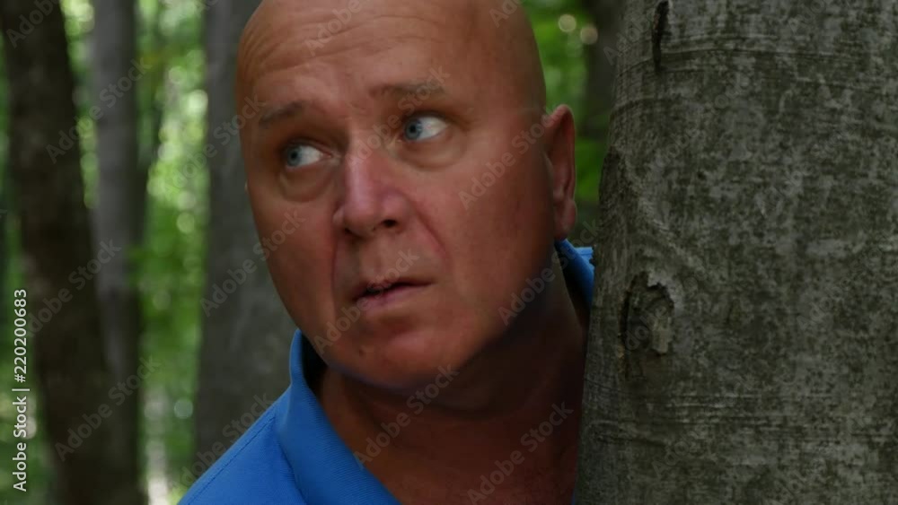 Scared Person Hiding and Running in The Wood Scared Person Hiding and Running in The Wood