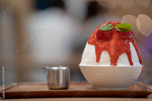 Korean shaved ice dessert with sweet toppings, Strawberry Bingsoo or Bingsu with soft focus