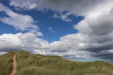 Clouds over sand dune