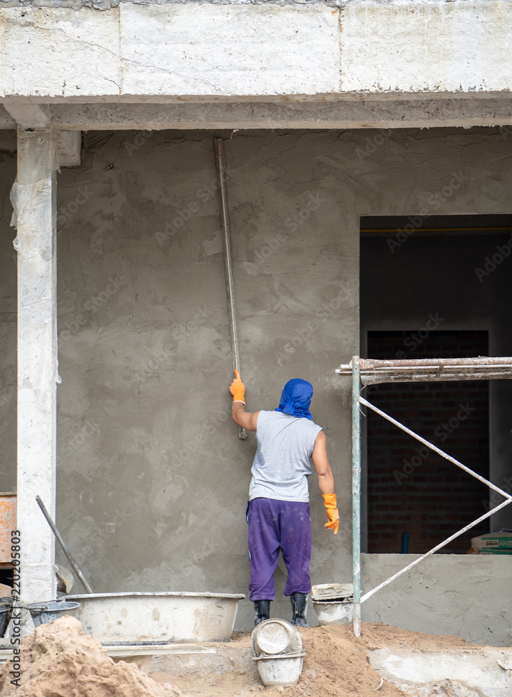 construction workers plastering building wall and beam using cement plaster  mix of cement and sand at the construction site in thailand foto de Stock |  Adobe Stock