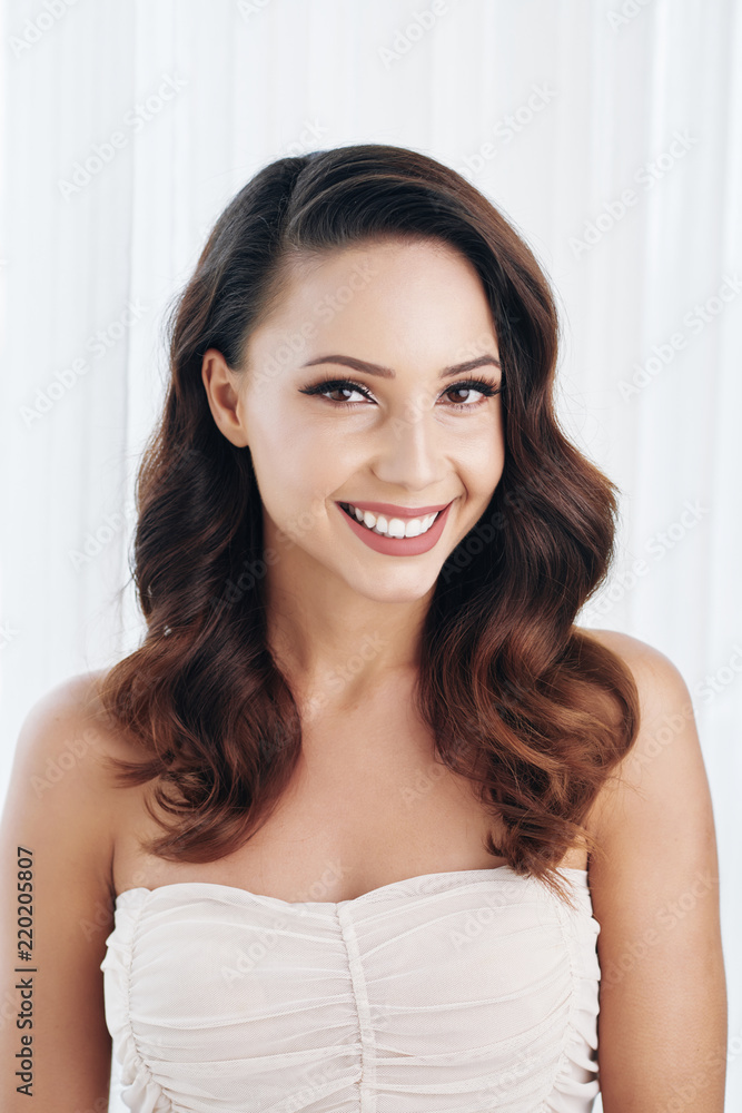 Beautiful smilng bride with toothy smile looking at camera Beautiful smilng bride with toothy smile looking at camera