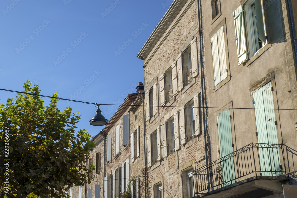 Naklejka premium Traditional architecture in the narrow streets of travel destination Penne d'Agenais, Lot et Garonne, France. This idyllic hilltop village has extensive views.