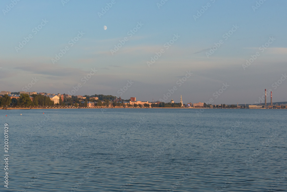 Votkinsk town at sunset with moon