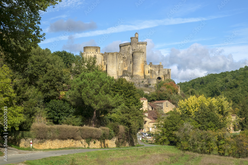 View to  imposing Chateau de Bonaguil near Fumel on a sunny autumn afternoon in Lot et Garonne, France