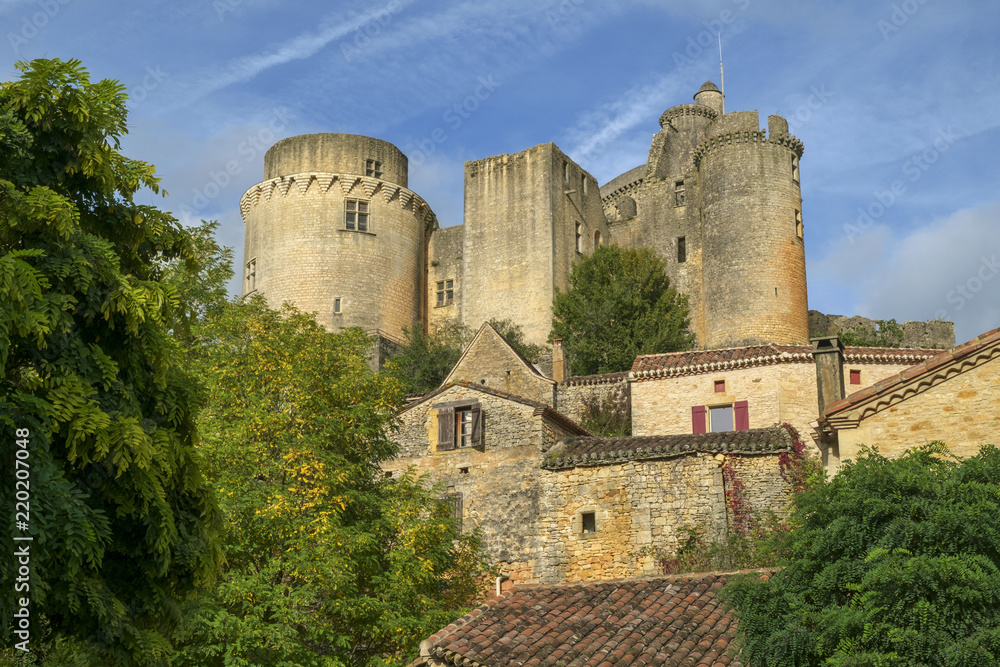 Looking up at historic and  imposing Chateau de Bonaguil near Fumel on a quiet sunny autumn afternoon in Lot et Garonne, France