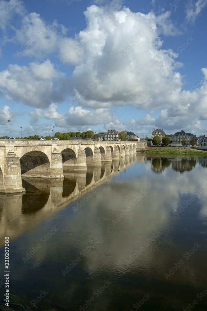 Reflections in a tranquil River Loire on a sunny autumn day in Saumur, Maine et Loire, France