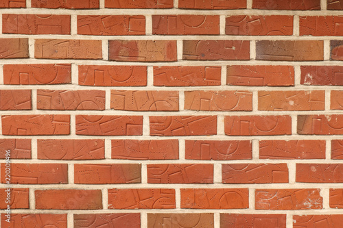textured wall of brick with ornament