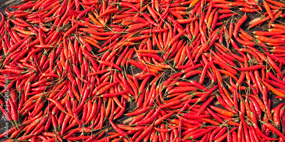 Background of red hot chili peppers at market in Hoi An, Vietnam