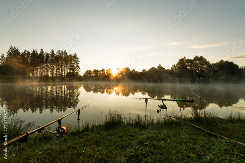 Carp fishing rods misty lake. photo