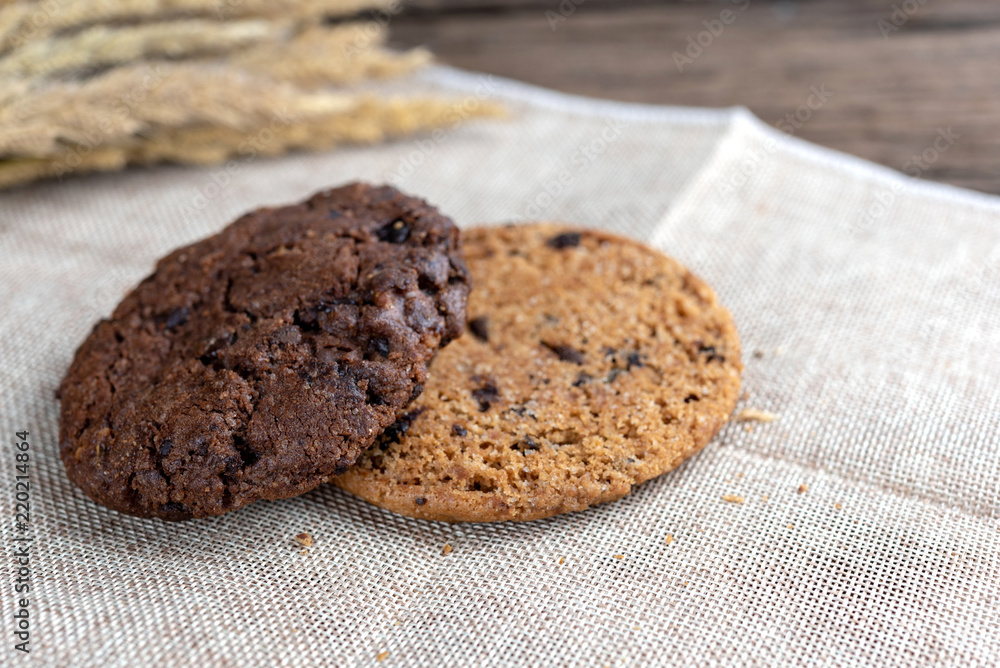Fototapeta premium Chocolate cookies on wooden table.