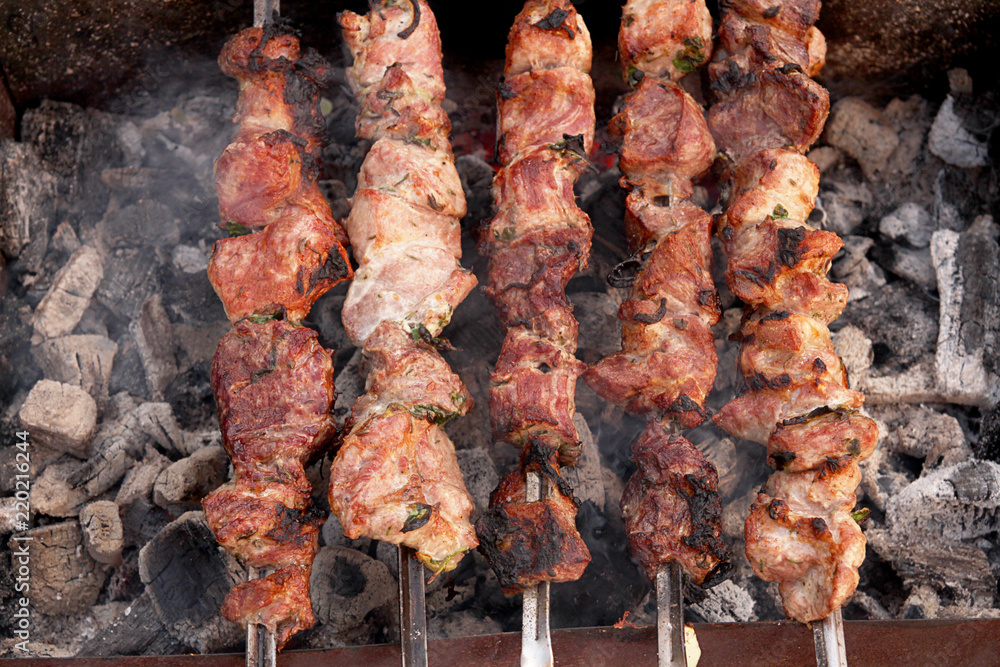 Fried meat on coals. Grill shish kebab. Barbecue pork on skewer