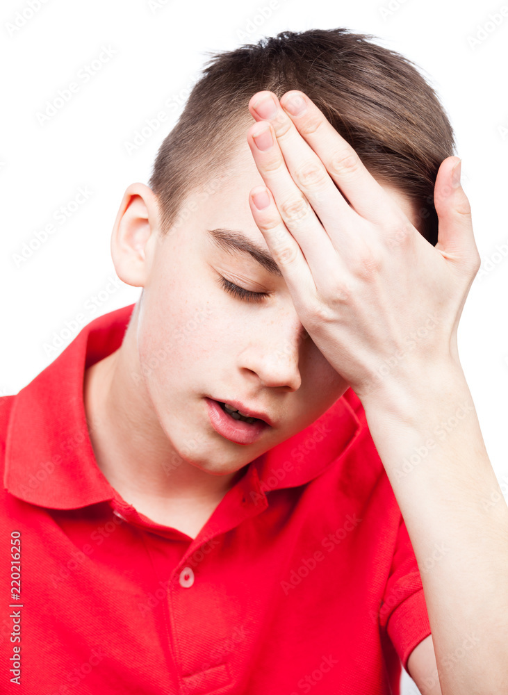 Teen boy with headache isolated on white Teen boy with headache isolated on white
