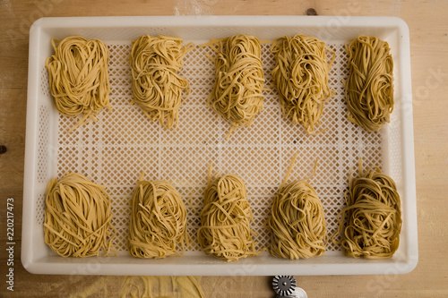 Overhead shot of rows of freshly made pasta.