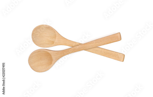 Empty wooden spoons isolated on white background, top view