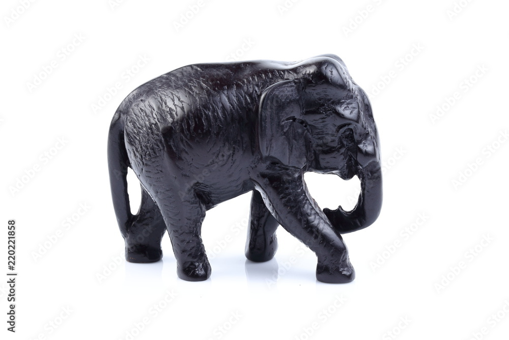 Obraz premium Black elephant like wooden carving with white ivory. Stand on white background, Isolated, Art Model Thai Crafts, For decoration Like in the spa.