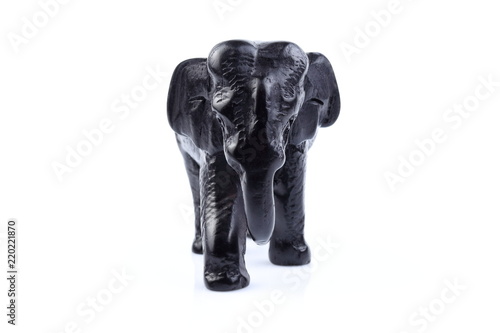 Black elephant like wooden carving with white ivory. Stand on white background  Isolated  Art Model Thai Crafts  For decoration Like in the spa.