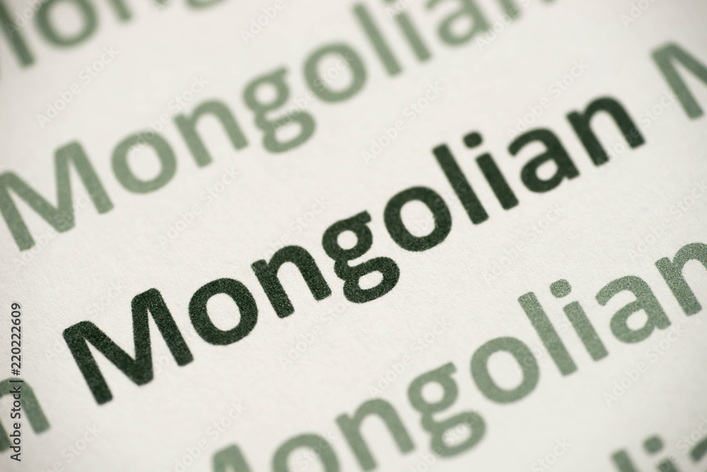 Fototapeta premium word Mongolian language printed on paper macro
