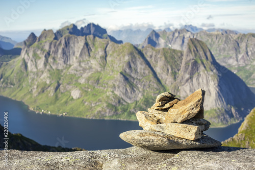 Path marker cairn on way to Munkan peak in Lofotens, Norway photo